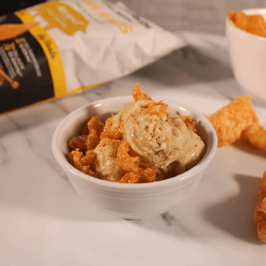 Homemade ice cream with sweet, honey pork rinds as topping.