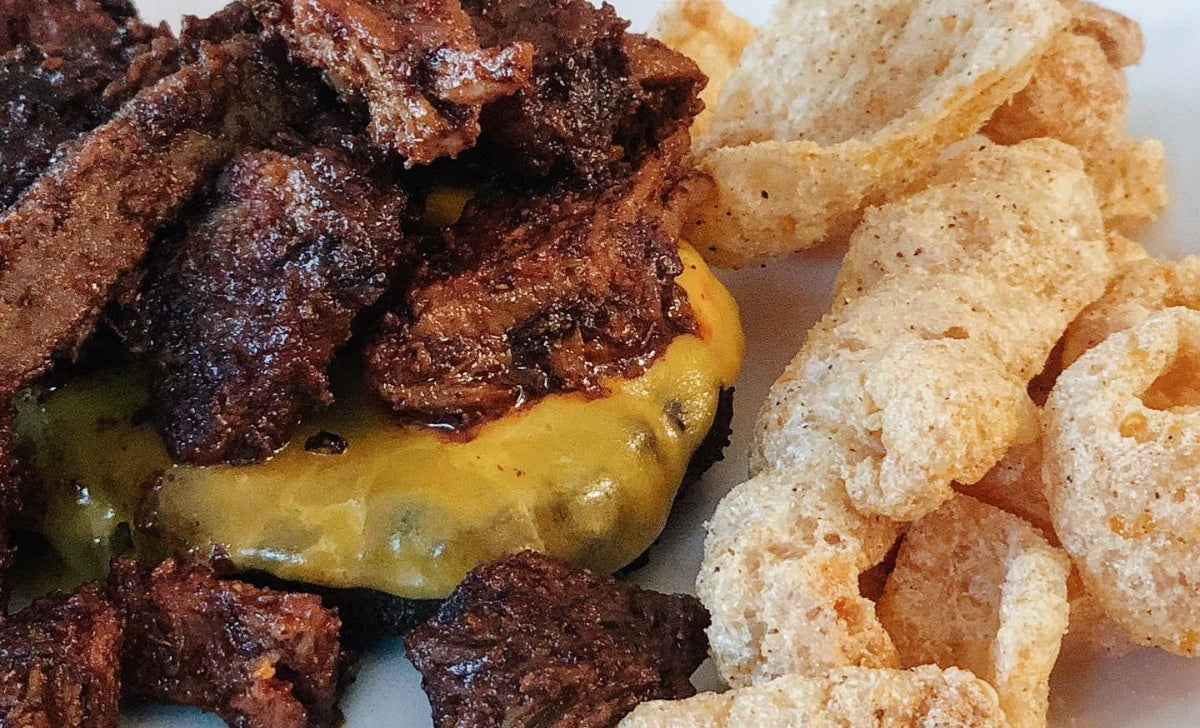Pork Rinds served with a hamburger